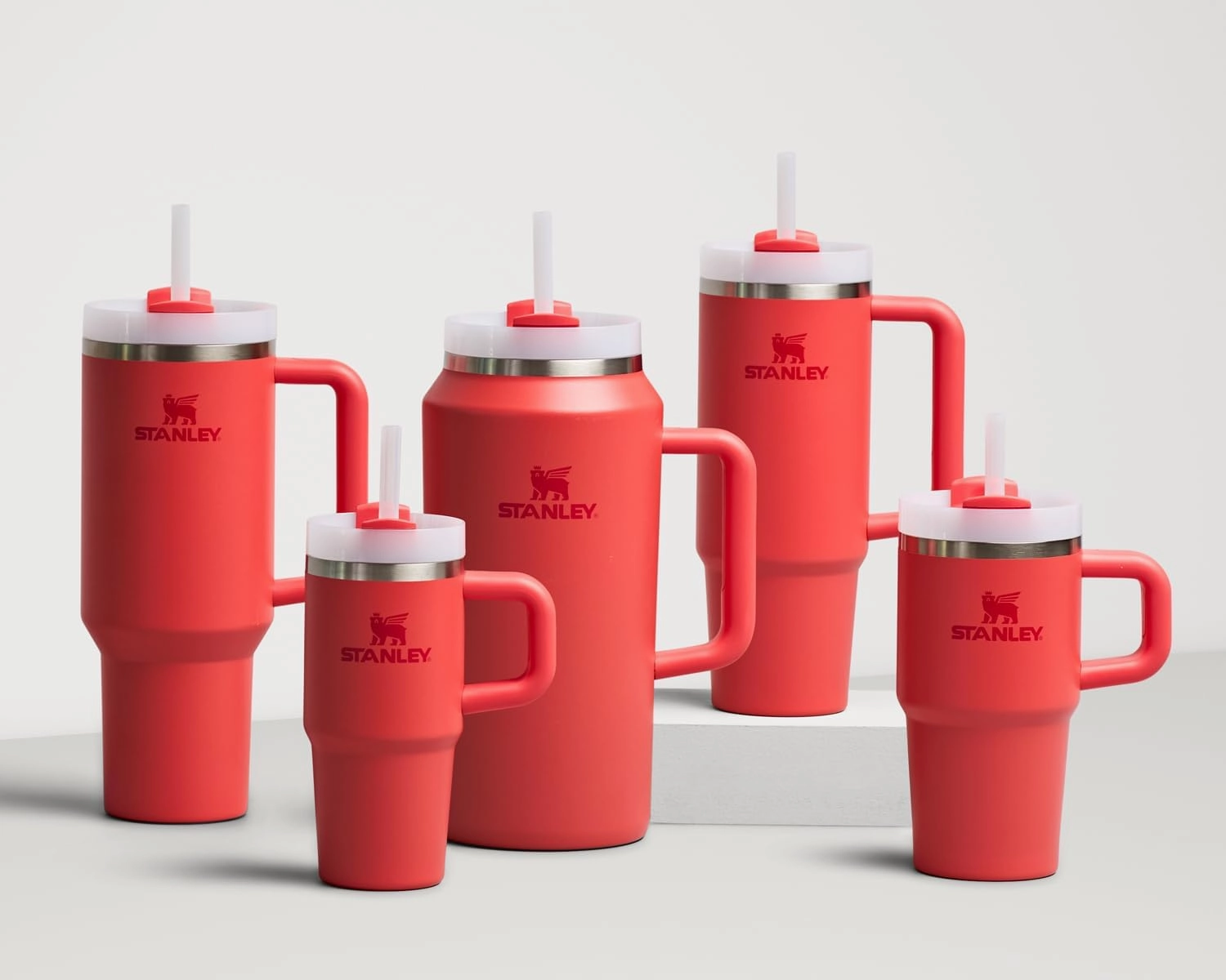 Stanley Quencher H2.0 Tumbler with Handle and Straw 20 oz | Flowstate 3-Position Lid | Cup Holder Compatible for Travel | Insulated Stainless Steel Cup | BPA-Free | Hot Coral